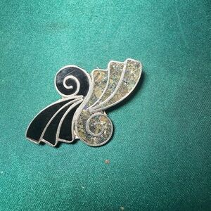 Elegant Black and Silver Swirl Brooch